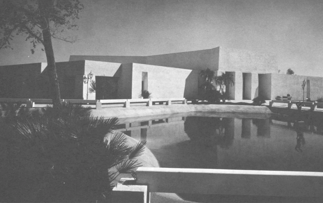 City Hall building with the pond in front of it.