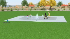 Children playing with water jets at an inclusive splash pad.