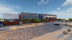 Rear view of Scottsdale Fire Station 612 showcasing three white garage doors.